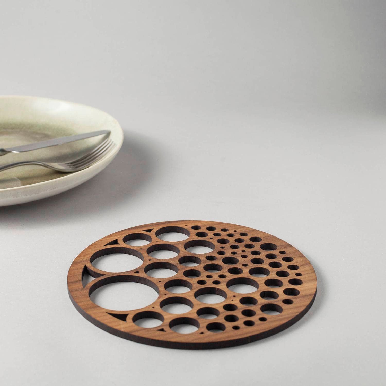 Bubbles drinks coasters in genuine walnut, geometry, circle packing